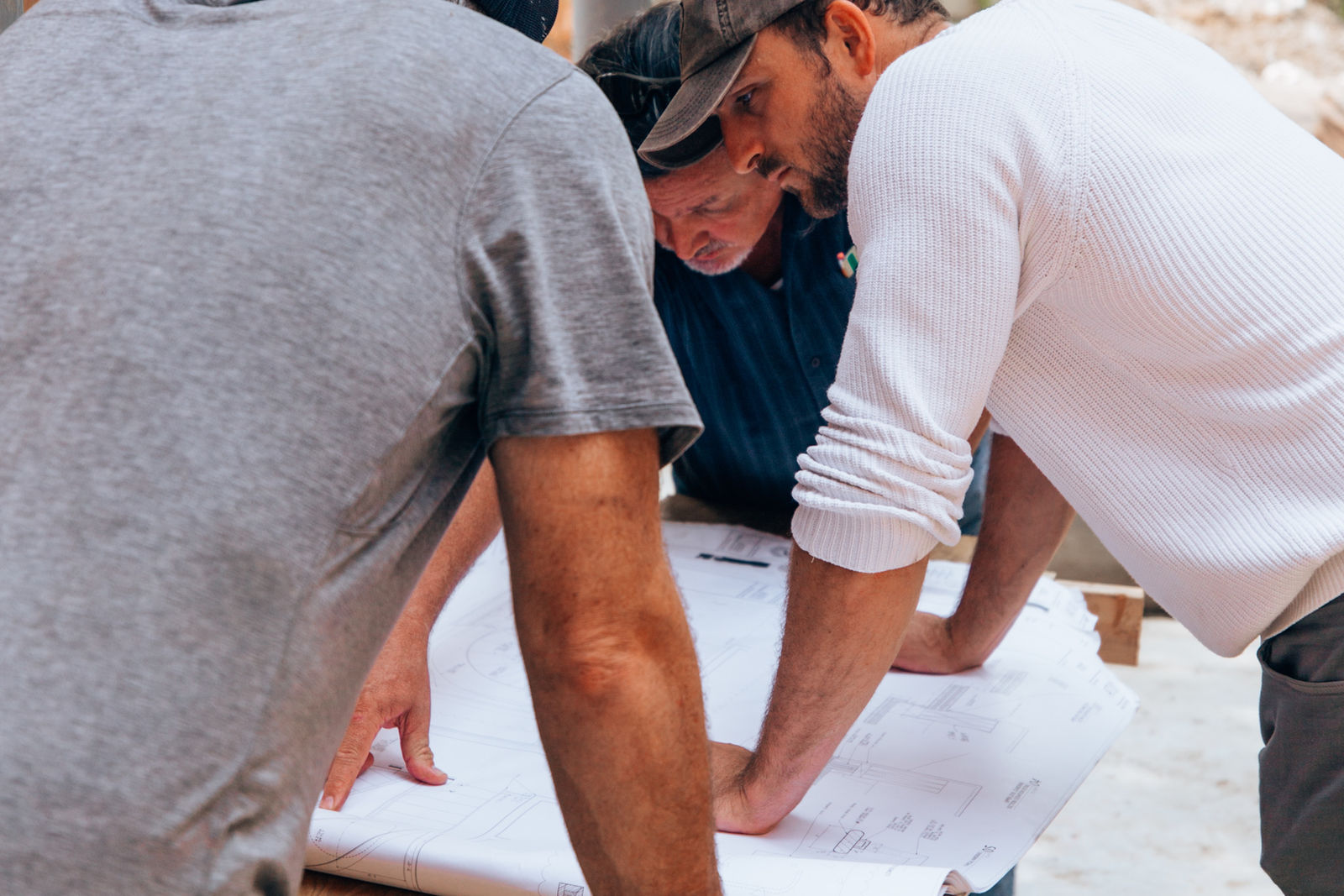Team reviewing project plans together on site